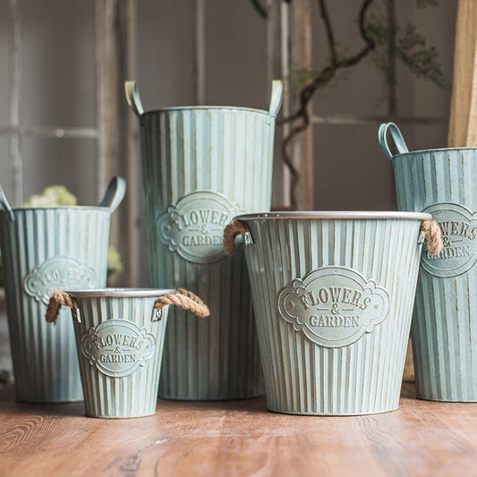 Vintage metal flower pot with a pewter effect